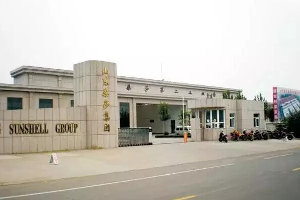 How does Sansa Group, which owns 17 garment processing plants, apply RFID systems to improve efficiency?